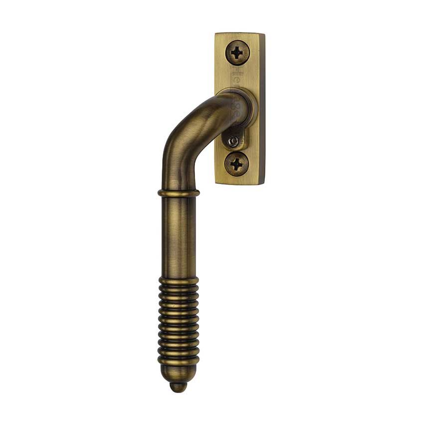 Picture of Heritage Brass Lockable Espagnolette Handle, Left Handed Reeded Design In Antique Brass - V895L LH-AT